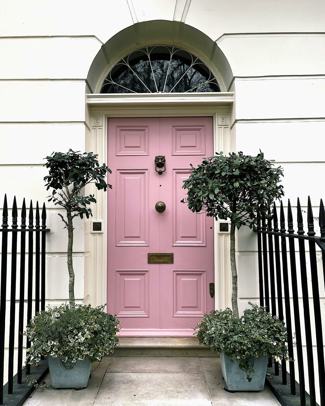 Pink composite front door fitted on a UK home