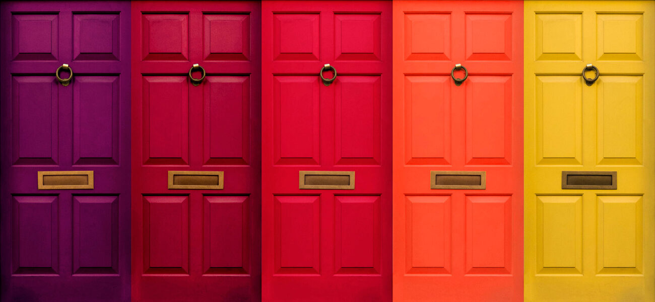 Row of composite doors in a range of colours