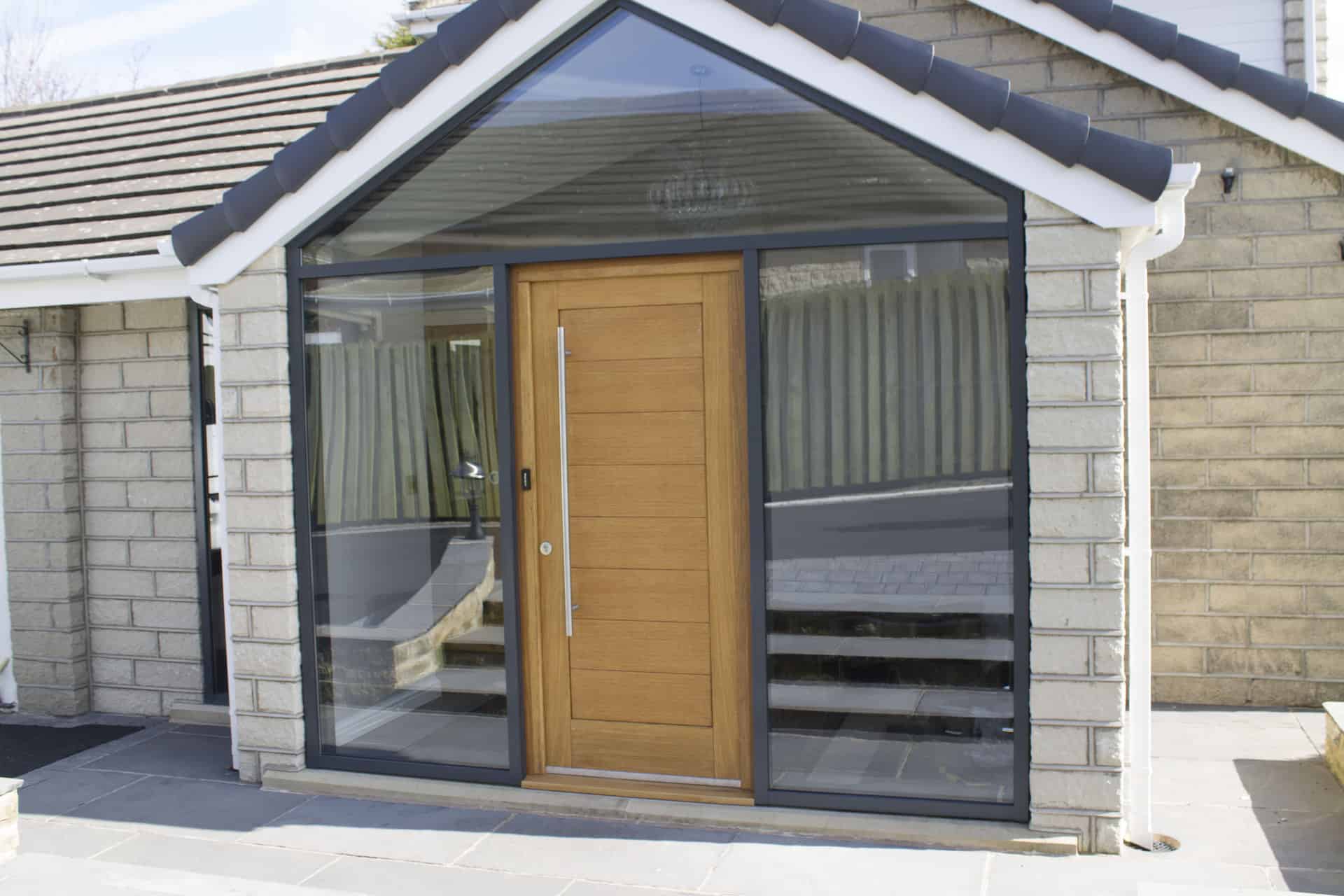 brown composite door with huge glass side panels