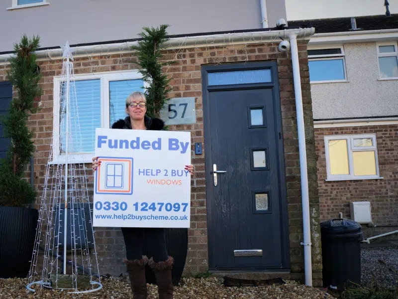 Grant customer infront of house with new casement windows